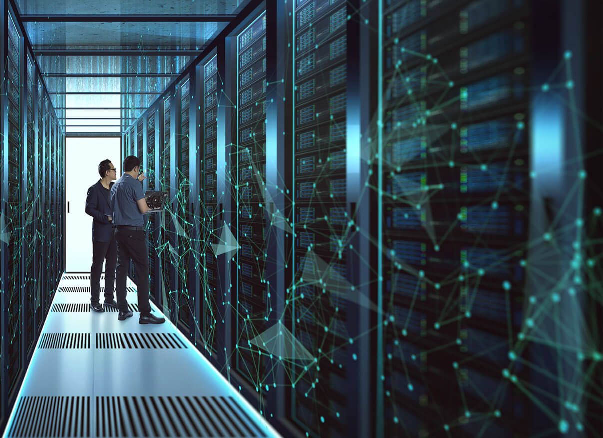 Man and woman standing in a server room